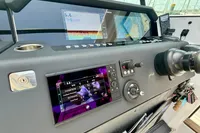 Control panel of 2020 Axopar 37 Cross Cabin with advanced navigation displays and joystick.