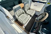 2020 Axopar 37 Cross Cabin interior with luxury seating and steering wheel.