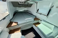 Interior of 2020 Axopar 37 Cross Cabin with multi-storage and seating.