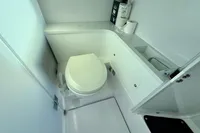 2020 Axopar 37 Cross Cabin bathroom with modern toilet and storage.