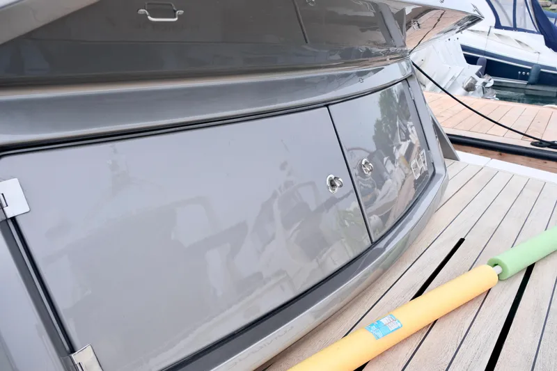  Yacht Photos Pics Sessa Marine Coupe 47 yacht, 2022 model, docked with pool noodles on deck.