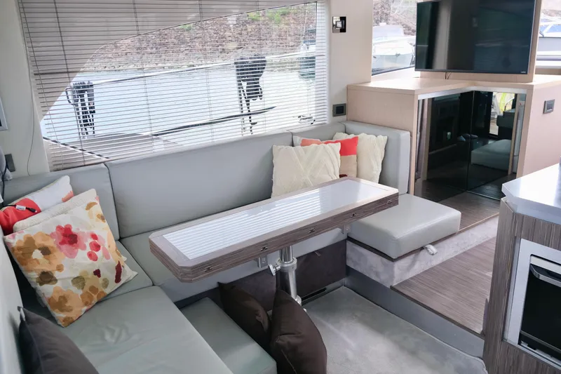  Yacht Photos Pics Interior of 2022 Sessa Marine Coupe 47 yacht with modern seating and decor.