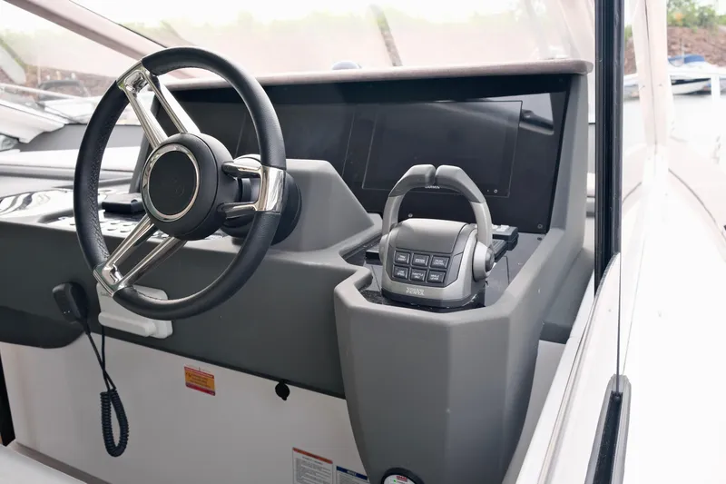  Yacht Photos Pics Steering wheel and controls of 2022 Sessa Marine Coupe 47 yacht cockpit.