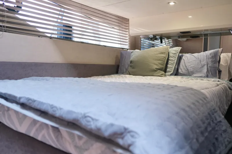  Yacht Photos Pics Interior cabin of 2022 Sessa Marine Coupe 47 with cozy bedding and modern design.
