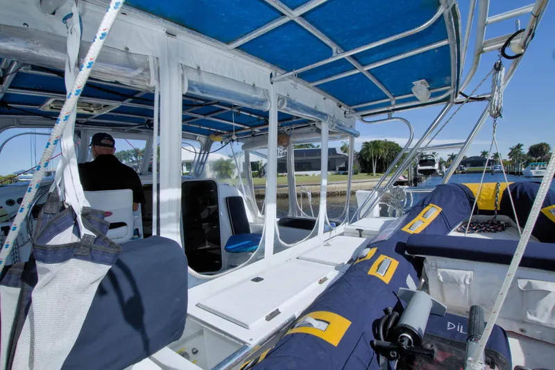 Scout Yacht Photos Pics Interior view of a 1996 Manta 40 catamaran with blue and white seating.