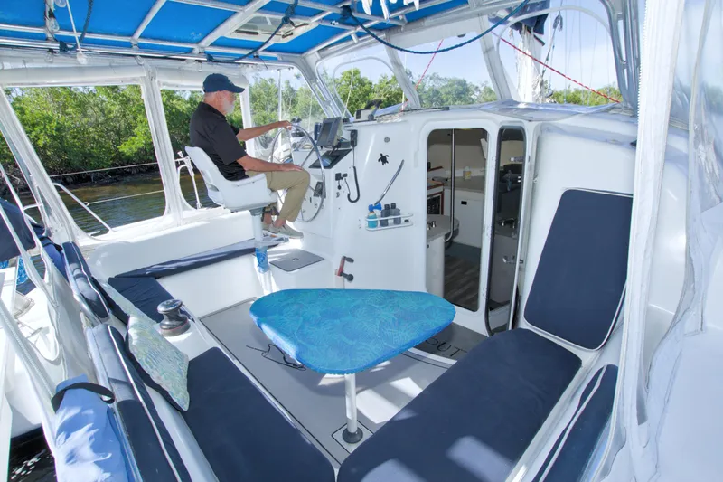 Scout Yacht Photos Pics Interior of a 1996 Manta 40 catamaran with helm, seating, and cabin entrance.