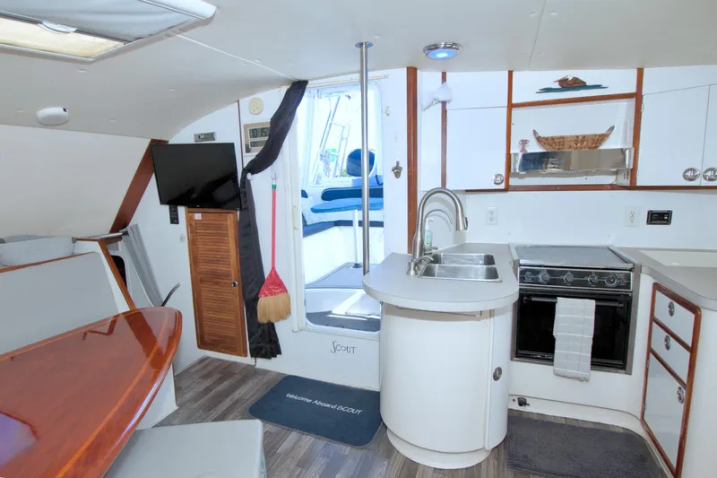 Scout Yacht Photos Pics Interior of 1996 Manta 40 yacht featuring kitchen, dining area, and modern amenities.