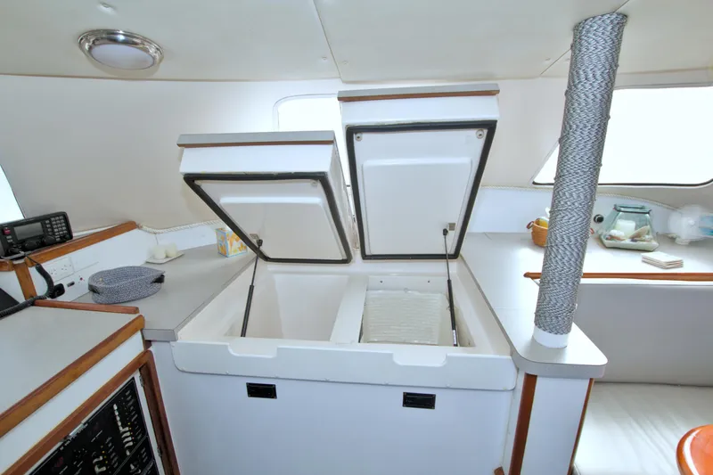 Scout Yacht Photos Pics Interior of 1996 Manta 40 yacht with open storage compartment and modern amenities.