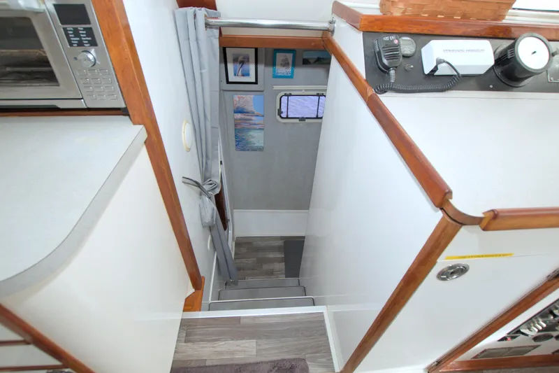Scout Yacht Photos Pics Interior view of a 1996 Manta 40 yacht, featuring stairs and modern appliances.
