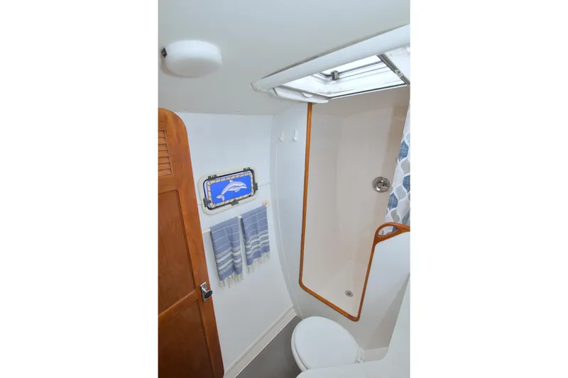 Scout Yacht Photos Pics Bathroom interior of 1996 Manta 40 yacht with shower and nautical decor.