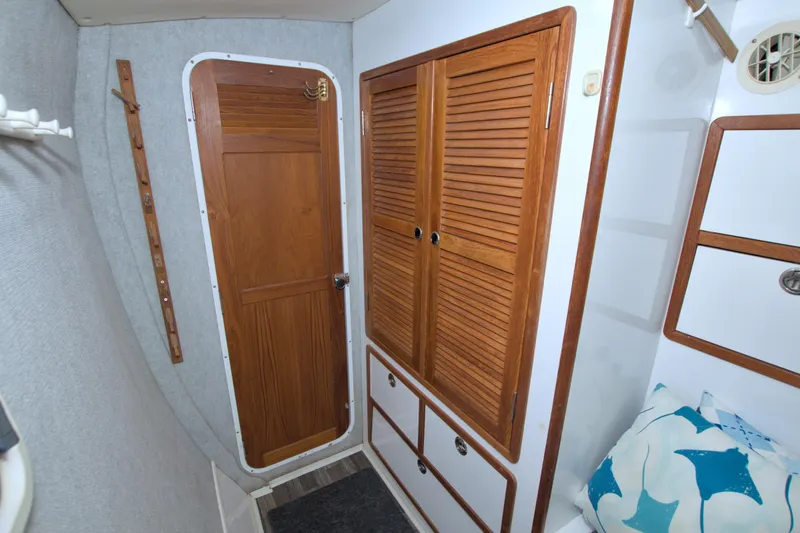 Scout Yacht Photos Pics Interior of 1996 Manta 40 sailboat with wooden doors and storage cabinets.