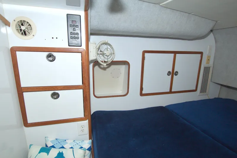 Scout Yacht Photos Pics Interior cabin of a 1996 Manta 40 yacht with storage and bedding.