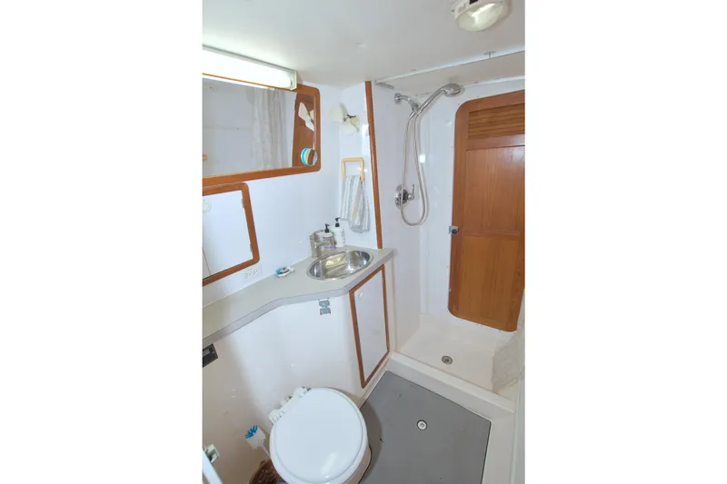 Scout Yacht Photos Pics 1996 Manta 40 yacht bathroom with shower, sink, and toilet.
