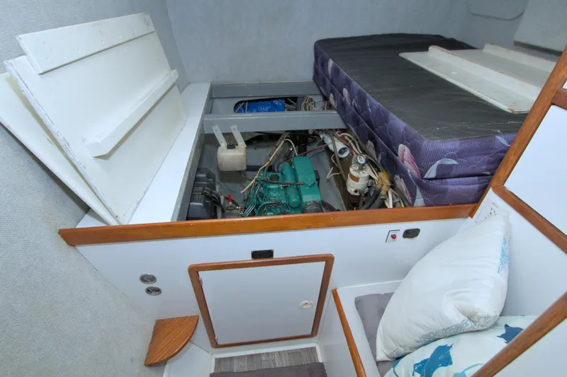 Scout Yacht Photos Pics 1996 Manta 40 interior showing engine compartment beneath bed with accessible panels.