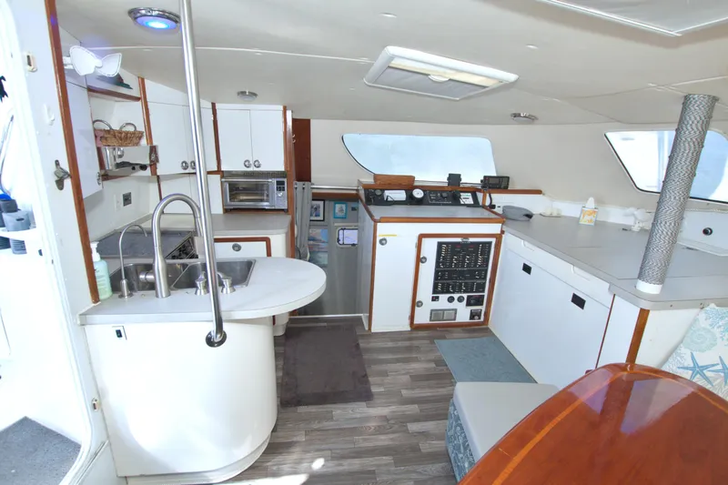 Scout Yacht Photos Pics Interior of 1996 Manta 40 yacht with kitchen and navigation area.