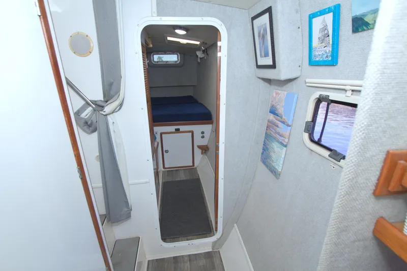 Scout Yacht Photos Pics Interior of a 1996 Manta 40 sailboat cabin with cozy decor and artwork.