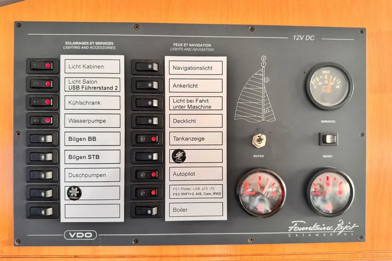 Searenity Yacht Photos Pics Control panel of 2005 Fountaine Pajot LAVEZZI 40 catamaran with switches and gauges.