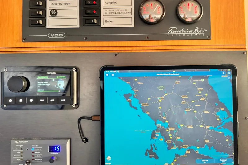 Searenity Yacht Photos Pics Control panel of a 2005 Fountaine Pajot LAVEZZI 40 catamaran with navigation display.