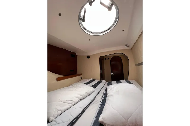 Searenity Yacht Photos Pics Interior cabin of 2005 Fountaine Pajot LAVEZZI 40 catamaran with cozy bedding.