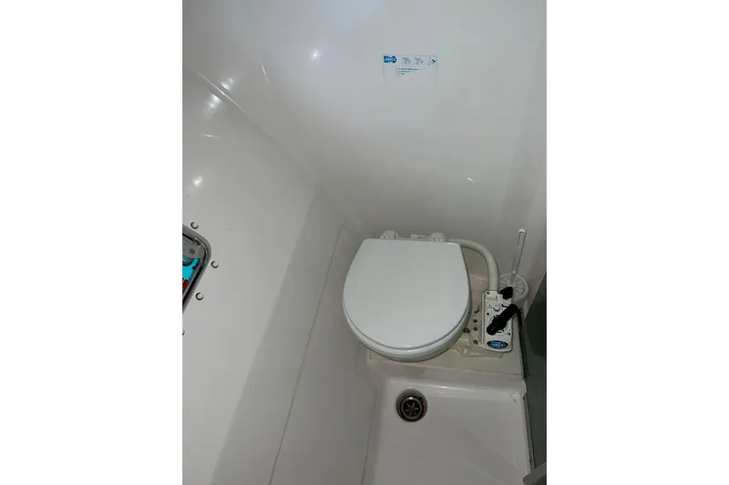 Searenity Yacht Photos Pics 2005 Fountaine Pajot LAVEZZI 40 yacht bathroom with compact marine toilet.