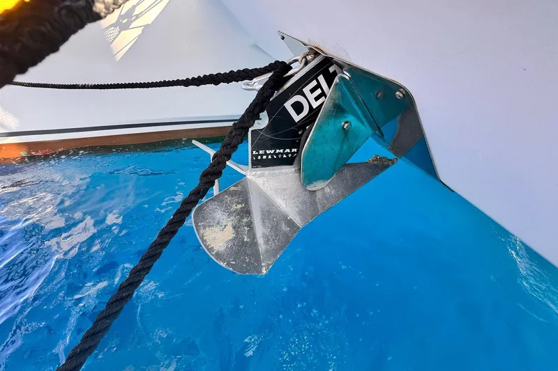 Searenity Yacht Photos Pics Anchor of 2005 Fountaine Pajot LAVEZZI 40 catamaran in clear blue water.