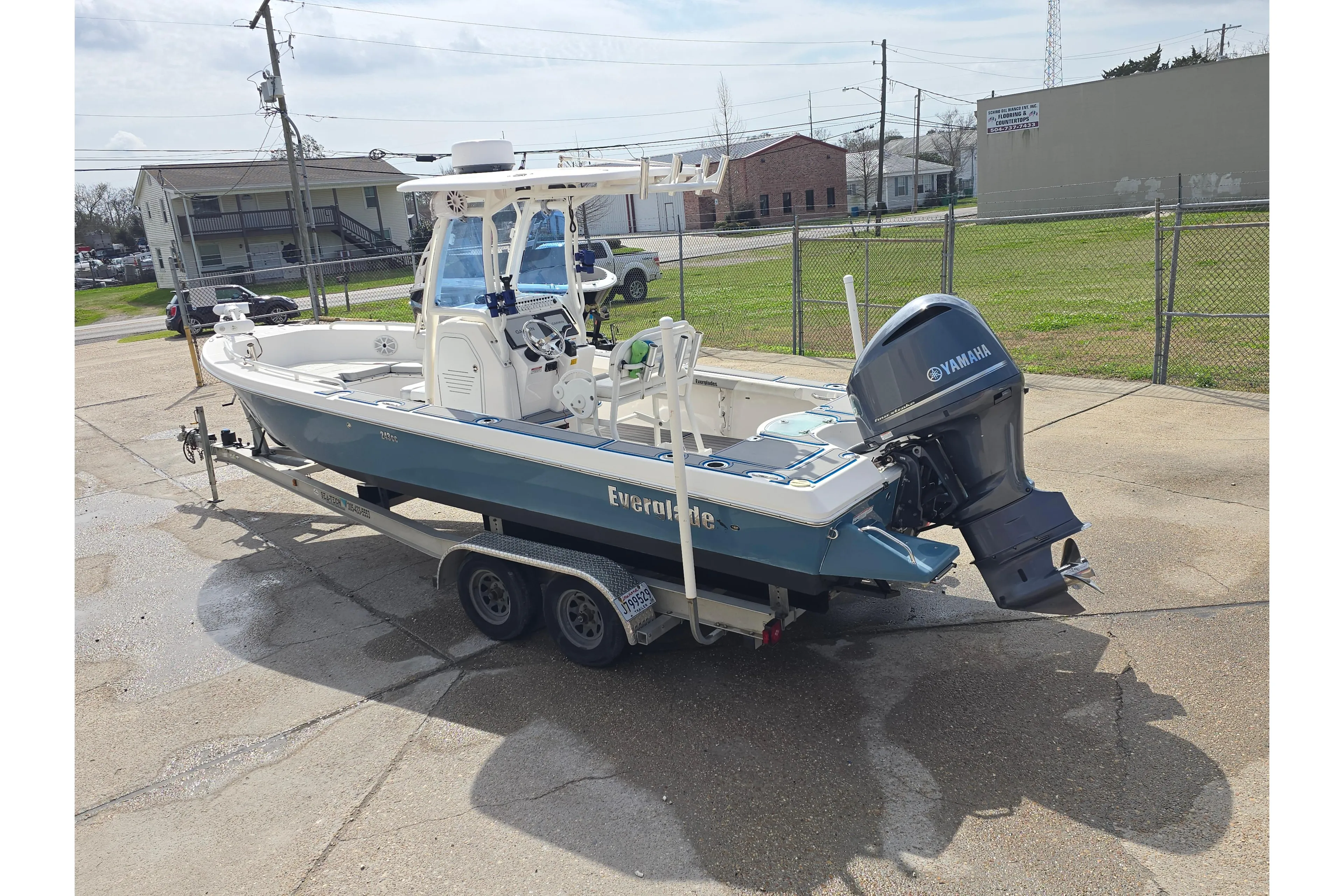 2012 Everglades 243 Center Console boat on trailer with Yamaha outboard motor.