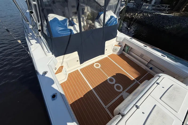  Yacht Photos Pics 2005 Grady-White Express 330 boat deck with wood flooring and seating.
