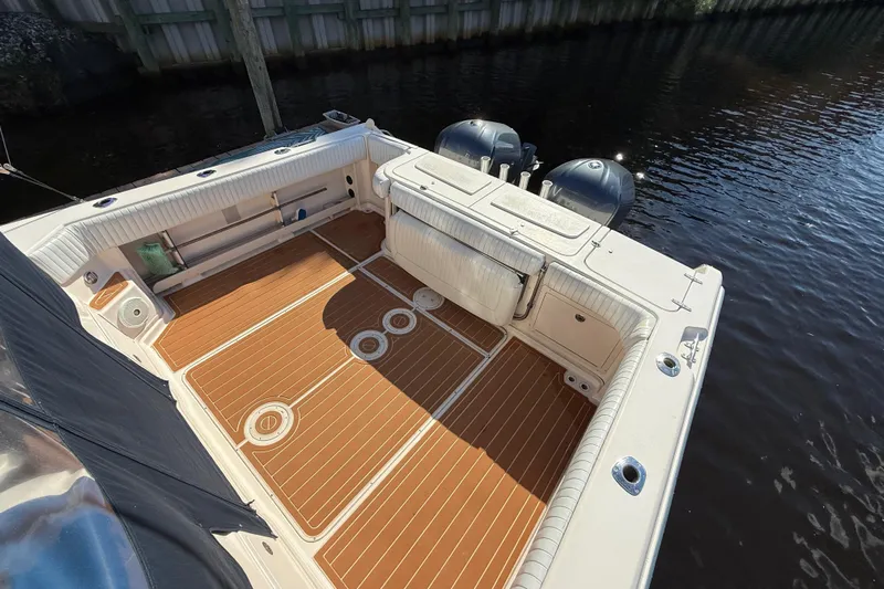  Yacht Photos Pics 2005 Grady-White Express 330 boat deck with wood finish and dual engines.