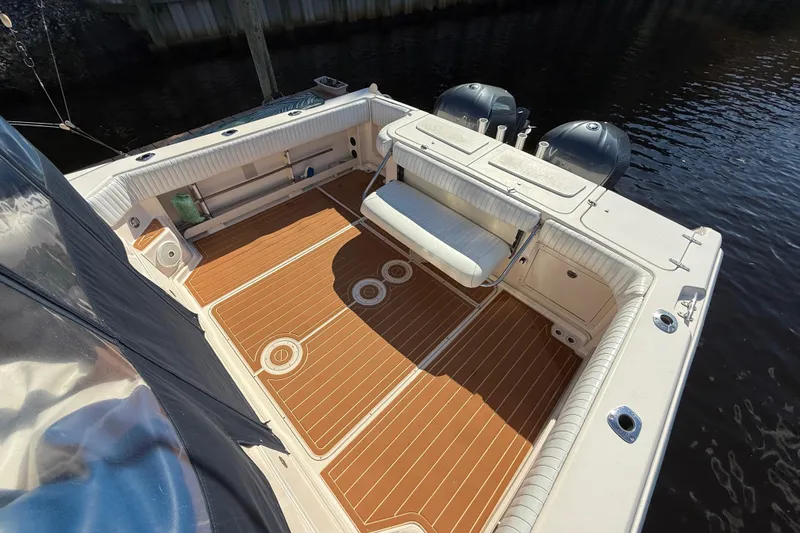  Yacht Photos Pics 2005 Grady-White Express 330 boat deck with seating and twin engines.