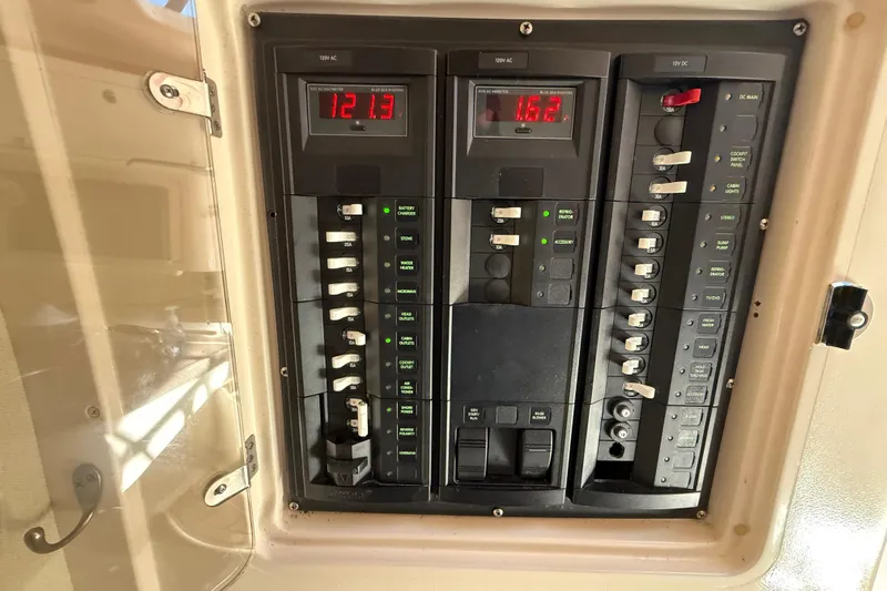  Yacht Photos Pics Electrical panel of a 2005 Grady-White Express 330 boat with digital displays.