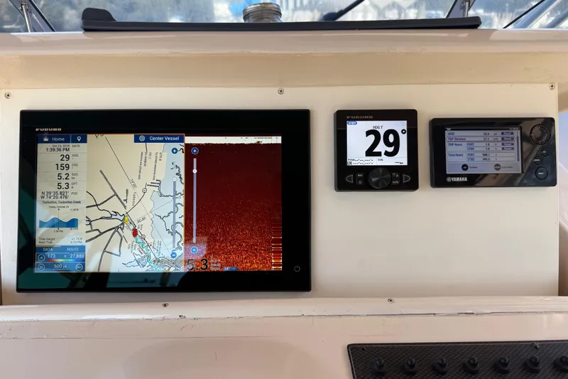  Yacht Photos Pics 2005 Grady-White Express 330 dashboard with navigation and control displays.