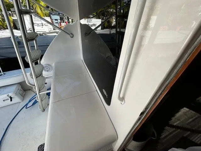  Yacht Photos Pics Bertram 45C 2008 boat, deck area with ladder and bench.