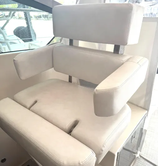  Yacht Photos Pics Luxury seating on 2013 Pursuit 365i Sport Coupe boat, featuring plush white upholstery.