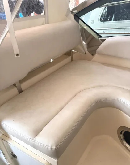  Yacht Photos Pics 2013 Pursuit 365i Sport Coupe interior with beige cushioned seating.