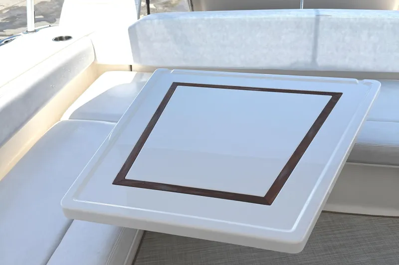  Yacht Photos Pics Luxury seating area on 2013 Pursuit 365i Sport Coupe yacht with elegant table design.