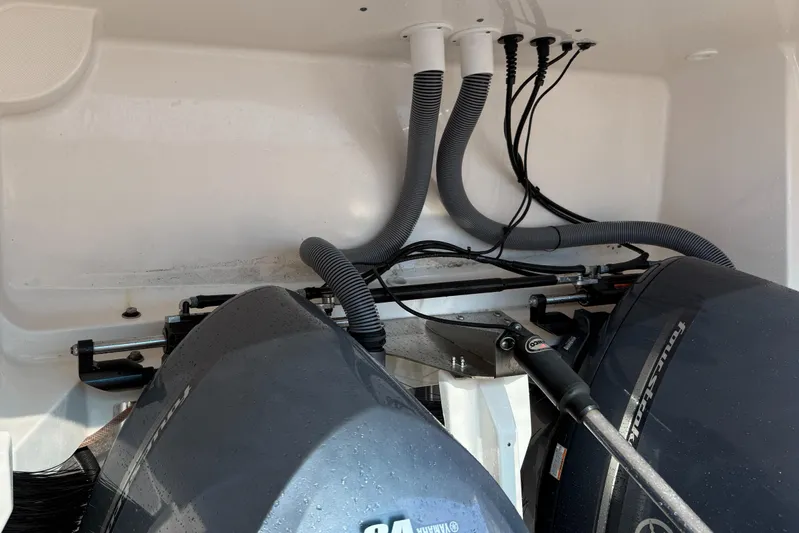  Yacht Photos Pics Engine compartment of a 2013 Pursuit 365i Sport Coupe with visible wiring and hoses.