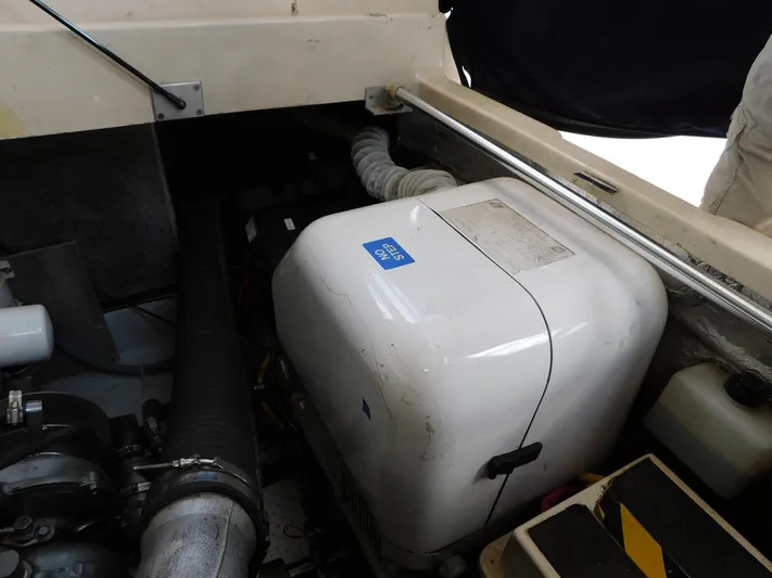 Calm Yacht Photos Pics Engine compartment of 2005 Mainship 34 Rum Runner with visible generator.