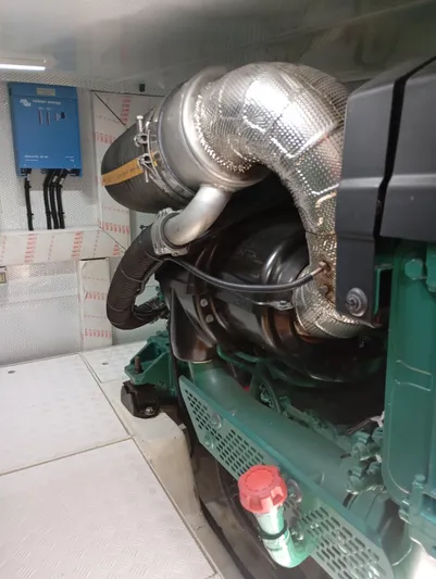  Yacht Photos Pics Engine room with Alen 55 model, 2016, featuring a large exhaust system and control panel.