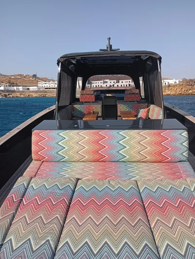  Yacht Photos Pics Luxury Alen 55 yacht with colorful zigzag seating, 2016 model, on serene blue waters.