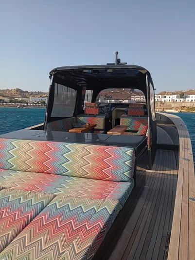  Yacht Photos Pics Luxury Alen 55 yacht with colorful seating, docked by the sea, 2016 model.