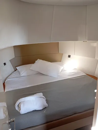  Yacht Photos Pics Luxurious cabin interior of 2016 Alen 55 yacht with cozy bed and pillows.