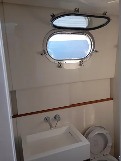  Yacht Photos Pics Bathroom interior of 2016 Alen 55 yacht with porthole window.