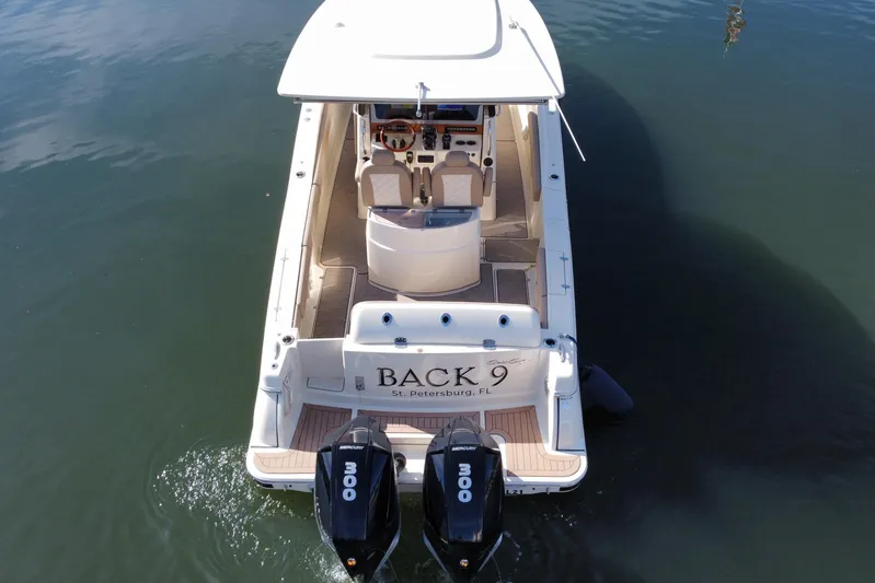  Yacht Photos Pics 2022 Chris-Craft Catalina 30 boat with dual Mercury engines, docked in calm water.