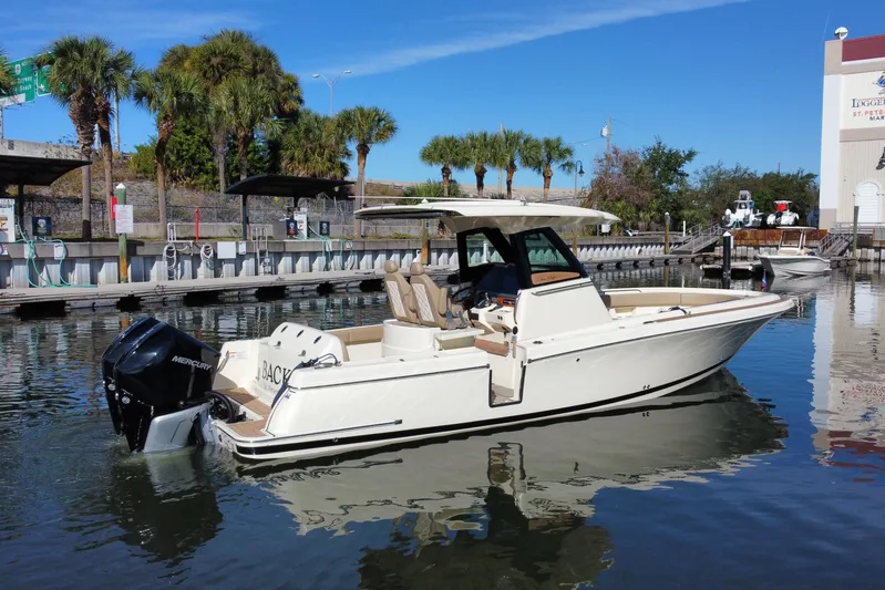  Yacht Photos Pics 2022 Chris-Craft Catalina 30 boat docked in a marina with palm trees.