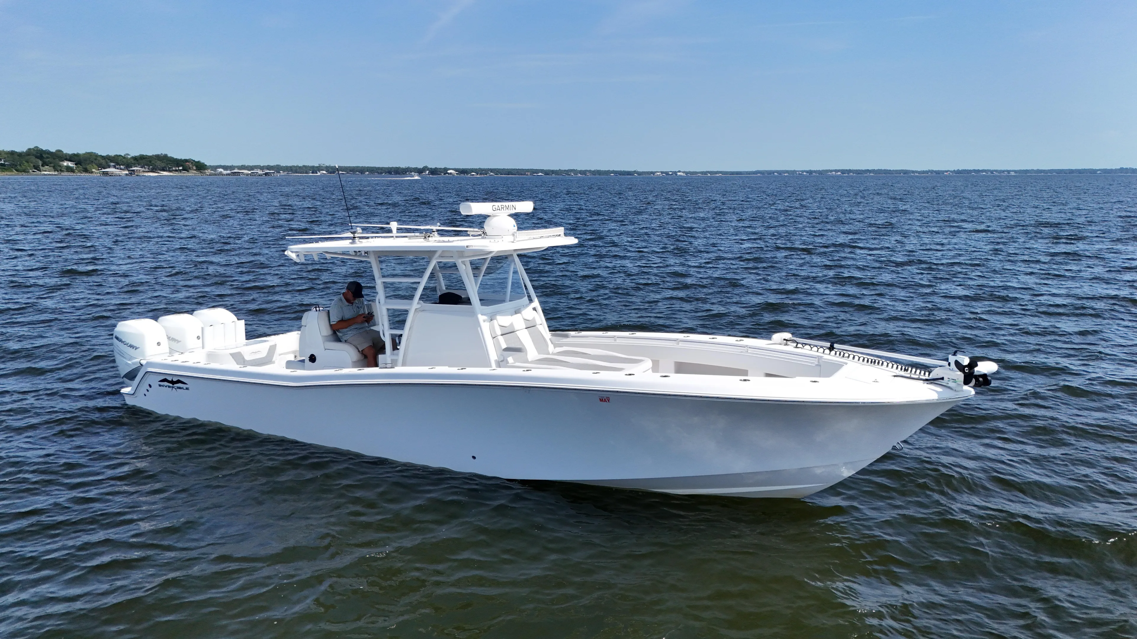  Yacht Photos Pics 2022 Invincible 36 Open Fisherman boat on calm ocean waters.