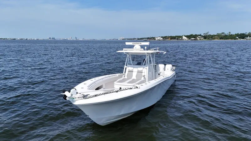  Yacht Photos Pics 2022 Invincible 36 Open Fisherman boat on calm waters, clear sky background.