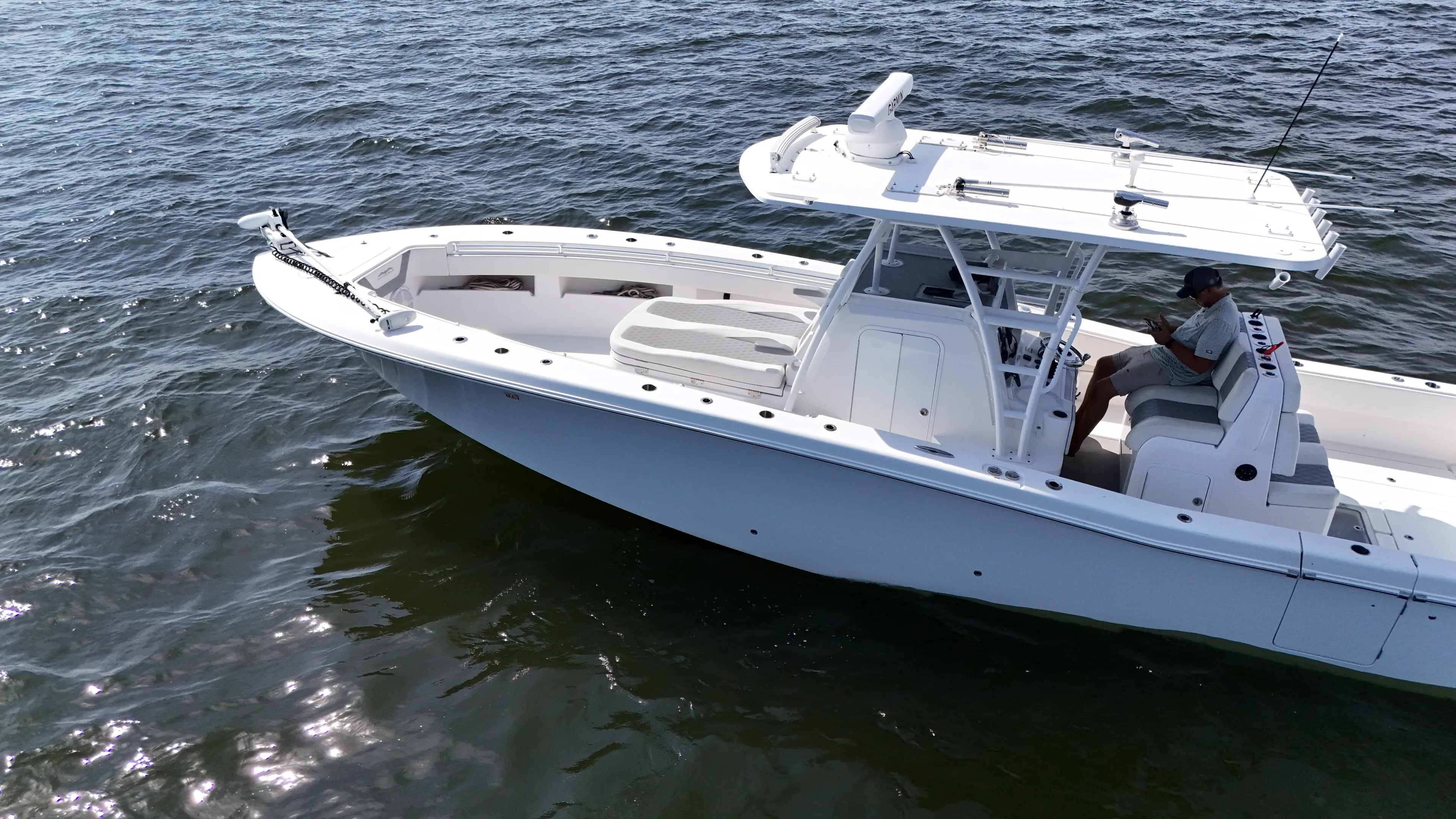  Yacht Photos Pics 2022 Invincible 36 Open Fisherman boat cruising on open water.