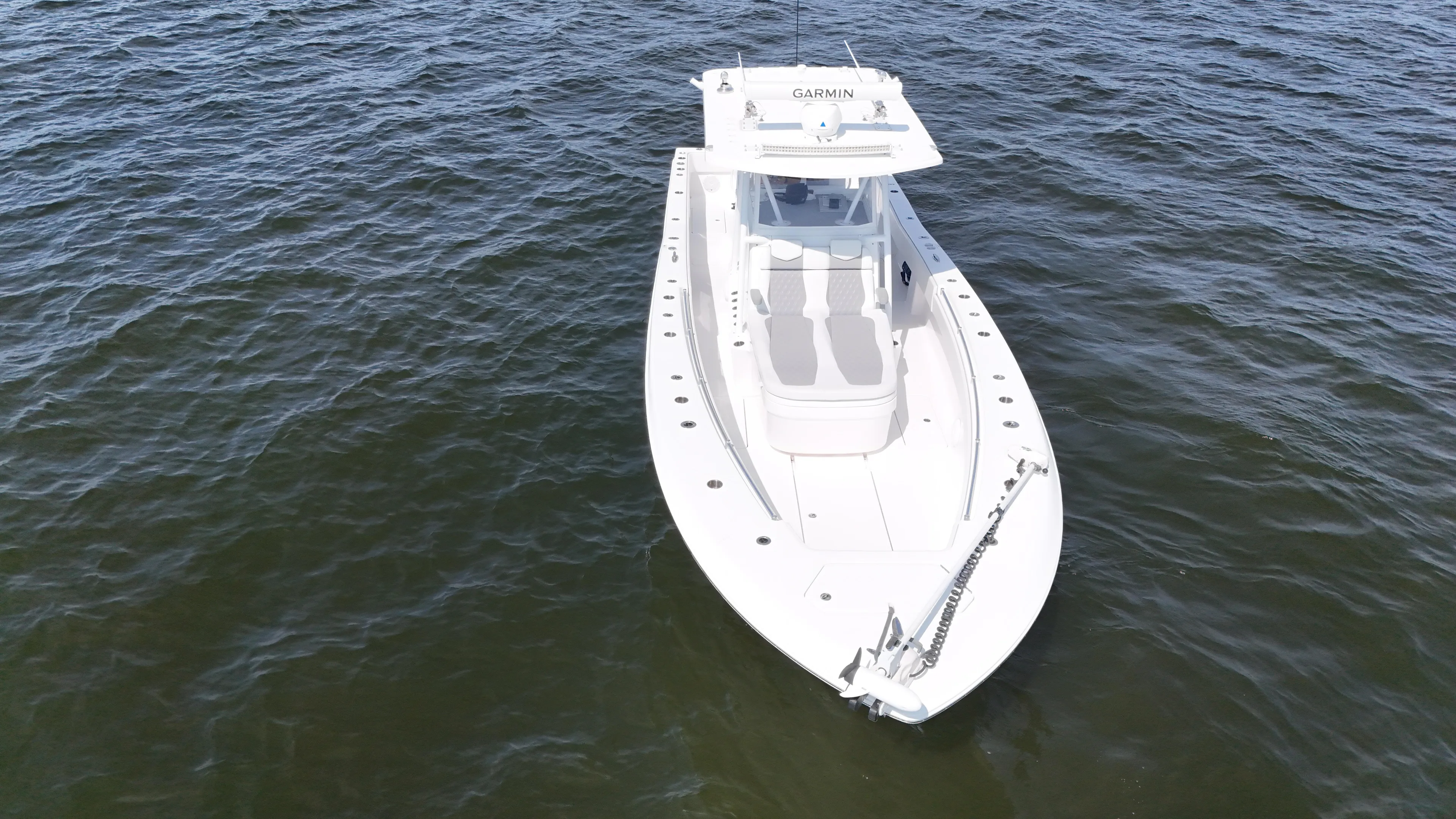  Yacht Photos Pics 2022 Invincible 36 Open Fisherman boat on open water, aerial view.