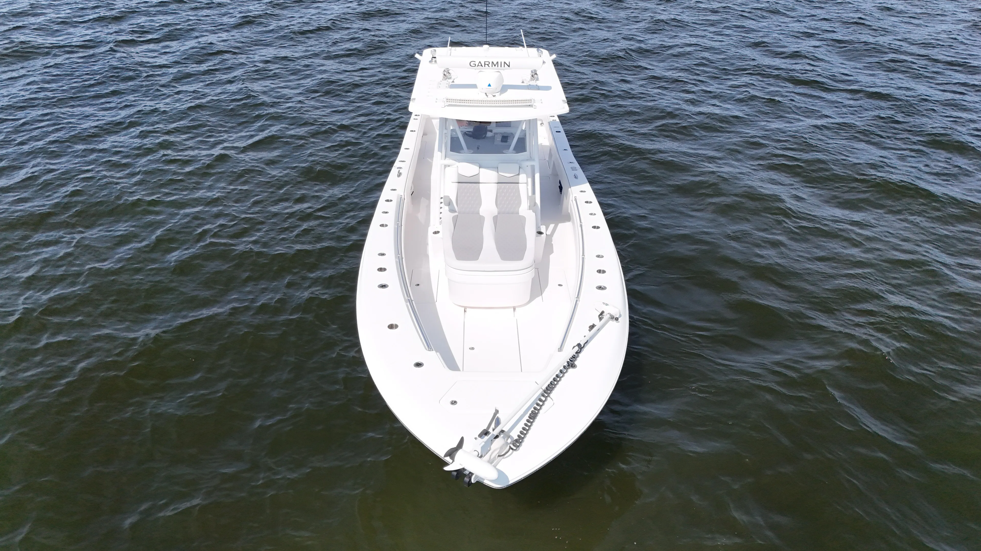  Yacht Photos Pics 2022 Invincible 36 Open Fisherman boat on open water, aerial view.
