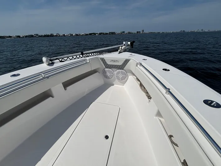  Yacht Photos Pics 2022 Invincible 36 Open Fisherman boat on calm waters, clear sky.